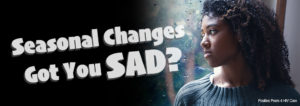 Seasonal Changes Got You Sad? With a picture of a woman looking out a rainy window.
